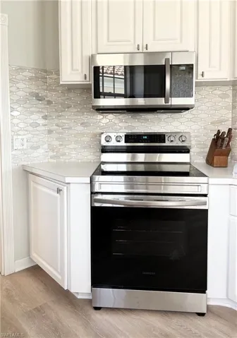 Kitchen featuring new backsplash tile