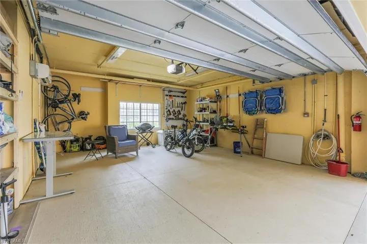 Garage featuring a garage door opener