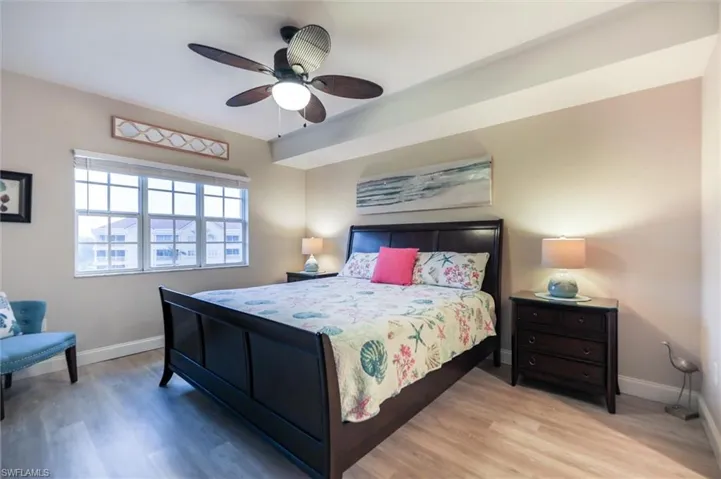 Bedroom featuring ceiling fan and light wood-type flooring