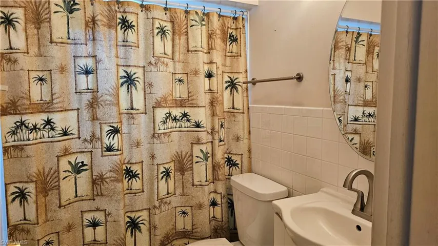 Bathroom featuring tub shower combo