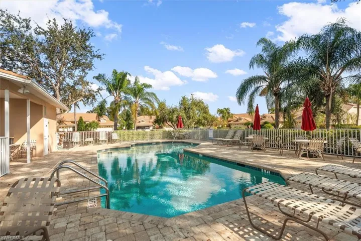 Community pool with a patio area.