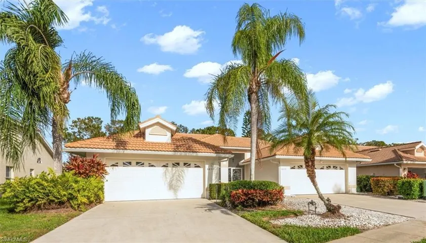 Mediterranean sttyle attached villa featuring driveway, a 2 car garage, stucco siding, and a tile roof