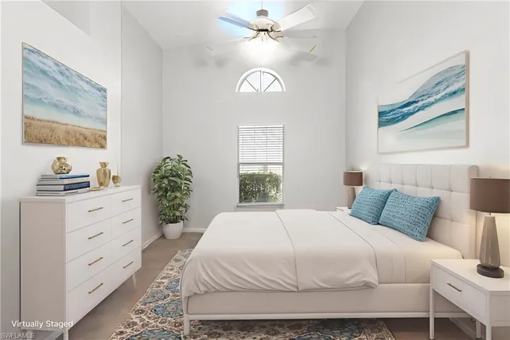 Den virtually staged as a 3rd bedroom.