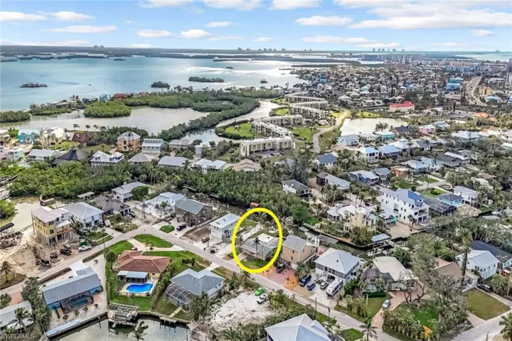 Drone / aerial view featuring a water view and a residential view