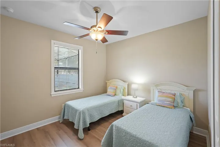 Bedroom with wood finished floors and a ceiling fan
