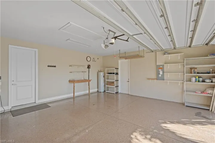 Garage with electric panel and water heater