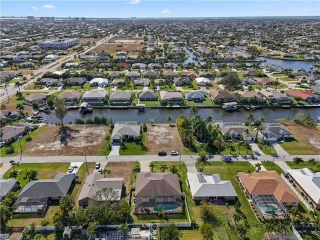 Aerial view of property's location featuring nearby suburban area