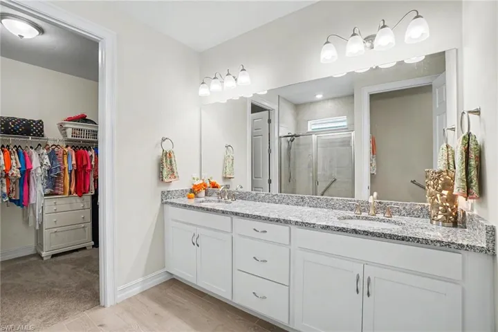 Primary Bathroom with LARGE walk in closet and dual sinks.