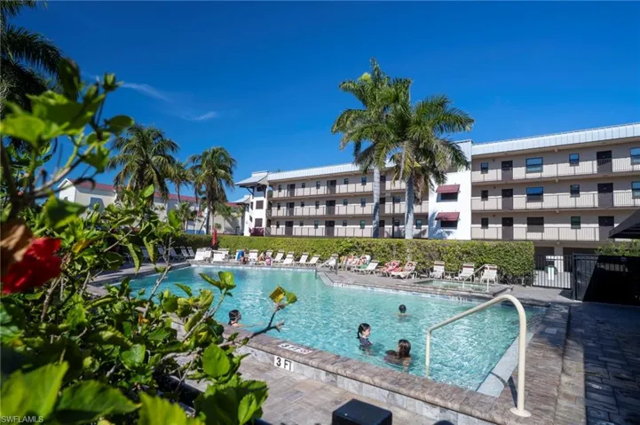 Community pool with a patio