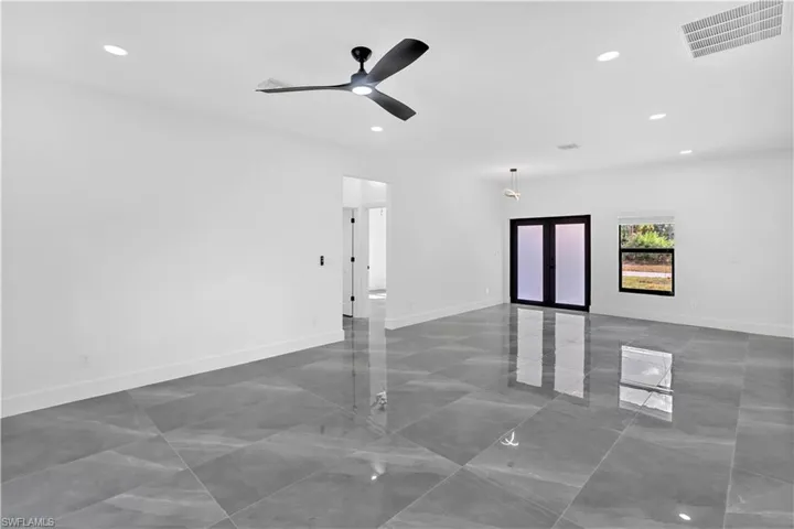 Empty room featuring recessed lighting and ceiling fan