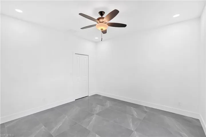 Unfurnished room with recessed lighting and ceiling fan