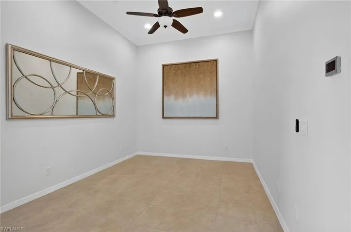 Empty room featuring ceiling fan, crown molding, and recessed lighting