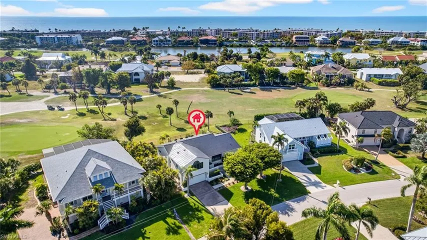 Aerial view of residential area featuring a golf club