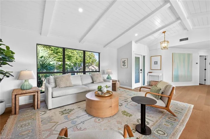 Living room featuring light wood-type flooring and recessed lighting