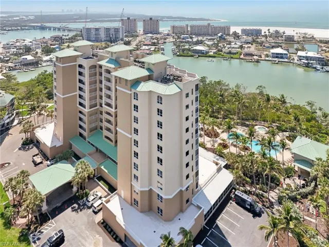 Birds eye view of property with a city view and a water view