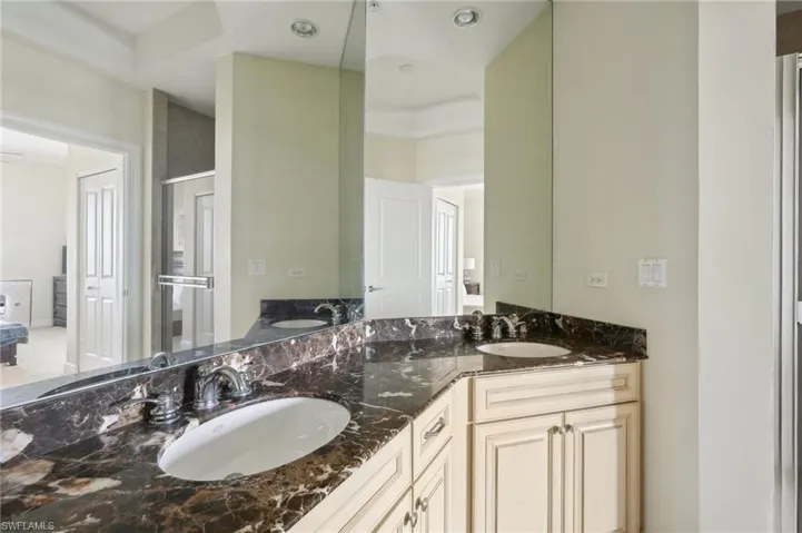 Bathroom featuring double vanity and a sink