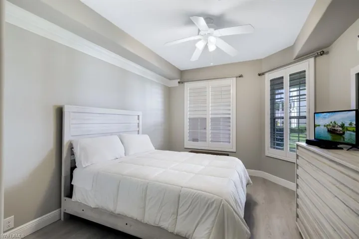 Bedroom featuring wood-type flooring and ceiling fan