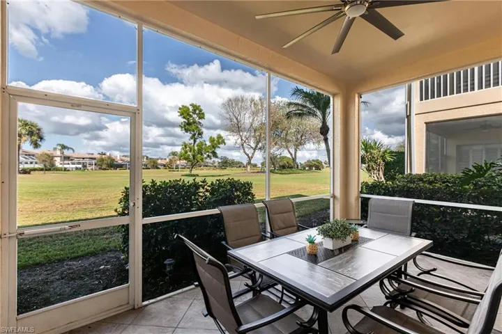 Sunroom / solarium featuring ceiling fan and outdoor dining area