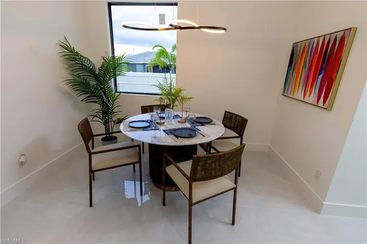 Dining room with light tile patterned floors
