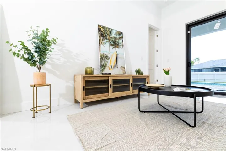 Living area featuring a healthy amount of sunlight and tile patterned floors