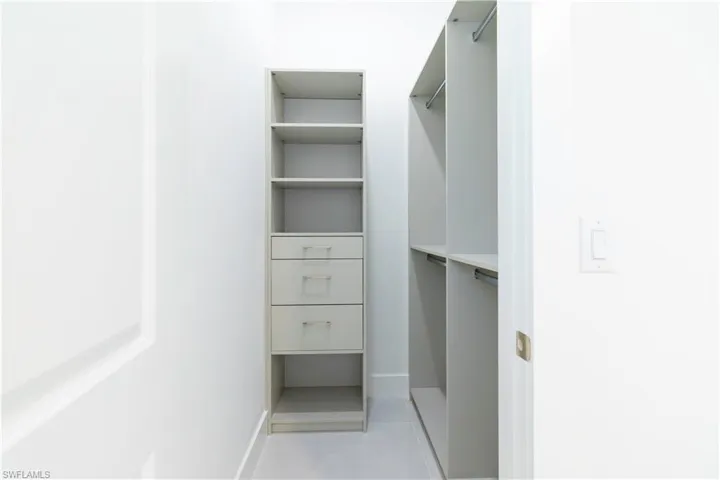 Walk in closet featuring light tile patterned floors