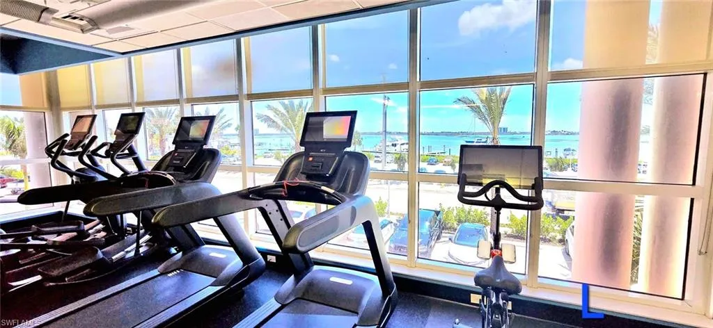 Workout area featuring a water view
