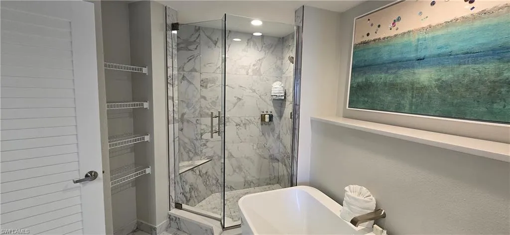 Bathroom featuring walk in shower