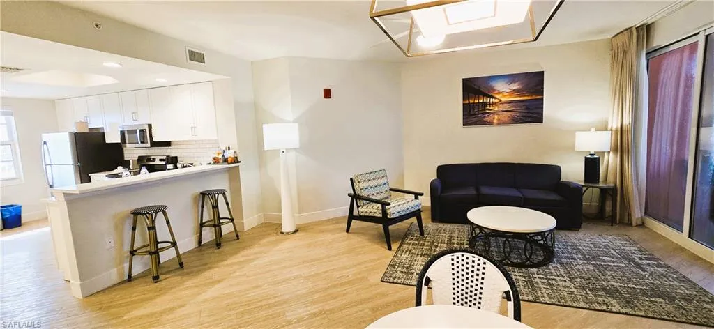 Liv/din room featuring light hardwood / wood-style floors