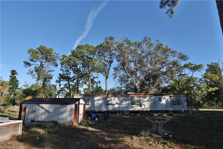 View of home's exterior with an outdoor structure