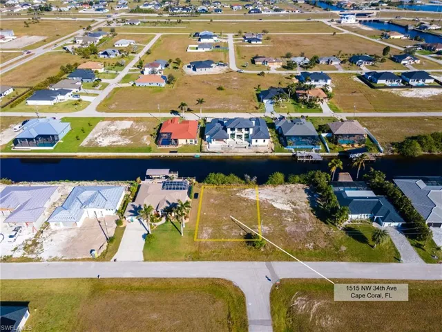 Drone / aerial view featuring a residential view and a water view