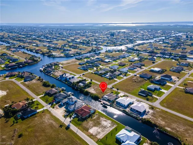 Birds eye view of property featuring a residential view and a water view