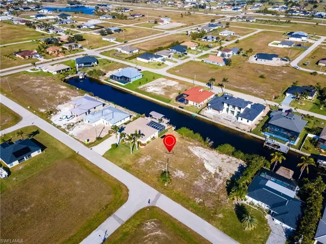 Drone / aerial view featuring a water view and a residential view