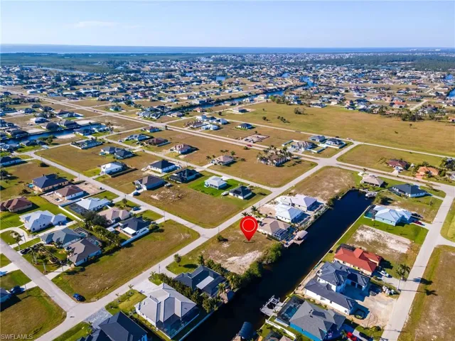Aerial view featuring a residential view and a water view