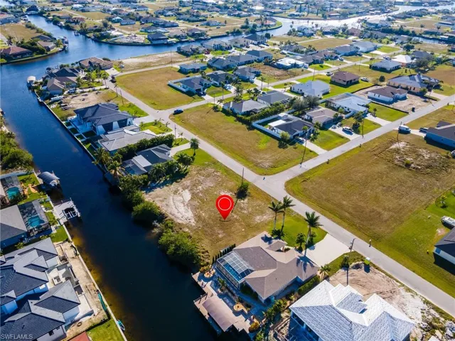 Aerial view featuring a water view and a residential view