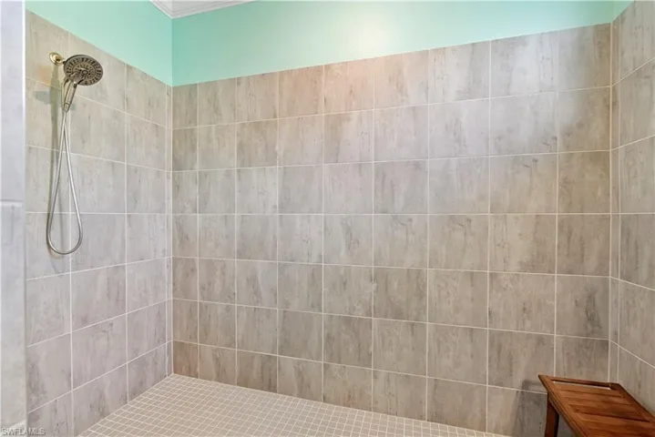 Bathroom featuring a tile shower
