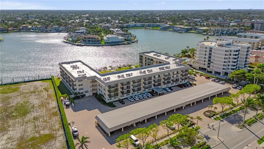 Bird's eye view of a large body of water and apartment complex / building