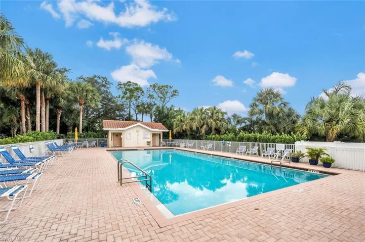 View of swimming pool with an outdoor structure and a patio area