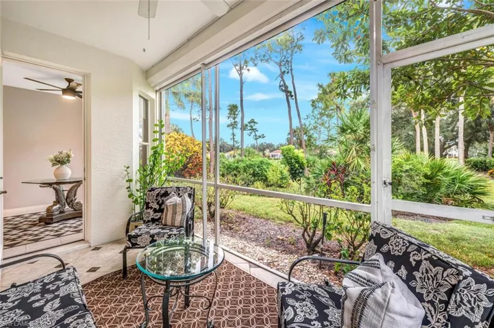 Screened lanai featuring ceiling fan