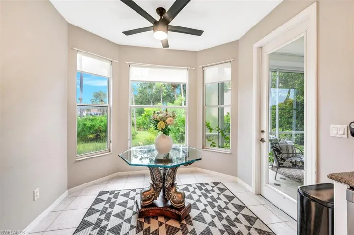 Breakfast space with ceiling fan and light tile patterned floors
