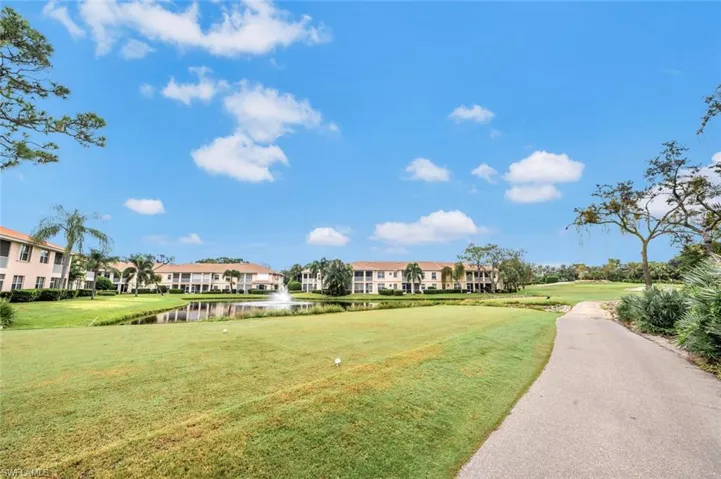 View of community with a fairway and a water view