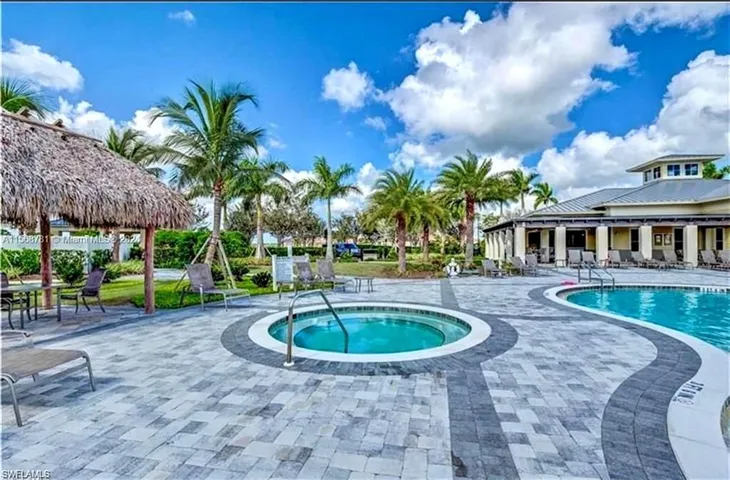 Inviting community swimming pool with spacious sun deck.