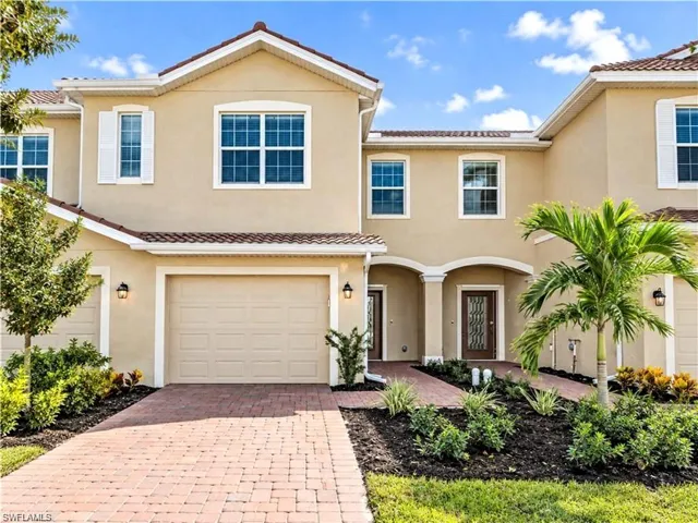 Welcoming exterior with attached garage and landscaped entry.