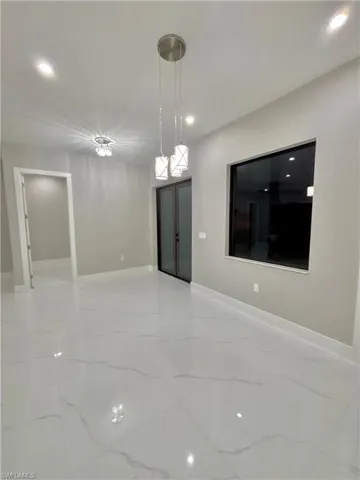 Spare room with recessed lighting and light marble finish floors