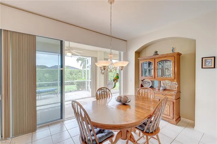 Dining area featuring light tile patterned floors and ceiling fan