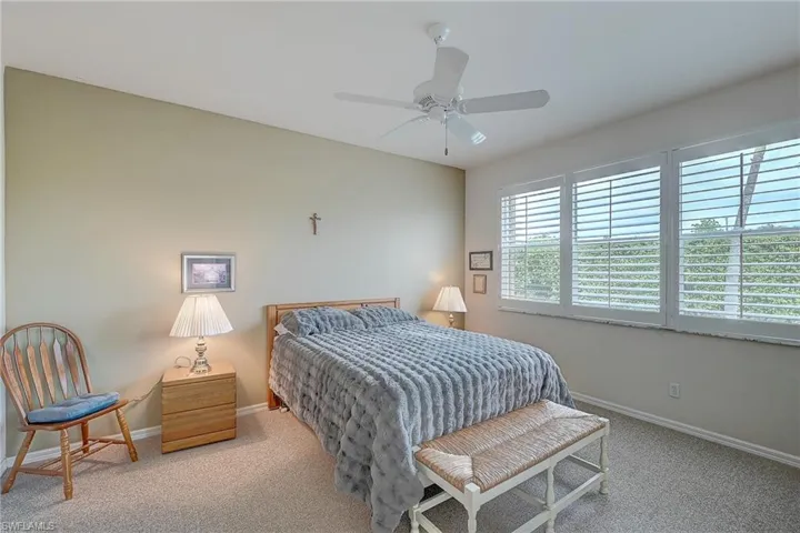 Bedroom featuring carpet and ceiling fan