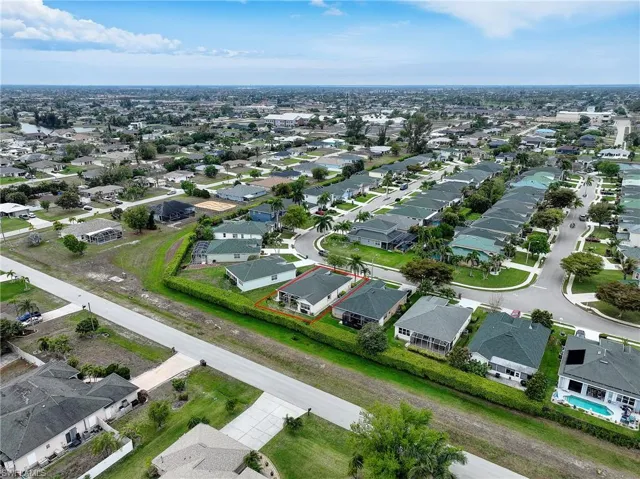 Aerial perspective of suburban area with property boundaries highlighted