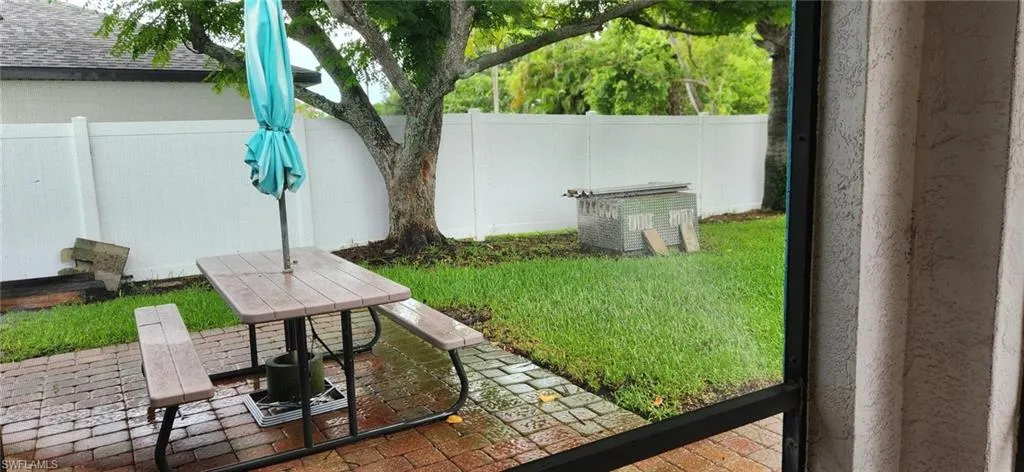 View of yard with a patio table