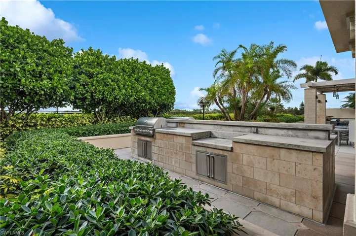 View of patio with two outdoor grills
