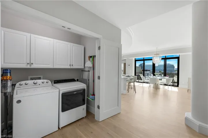 Laundry area with built in cabinets