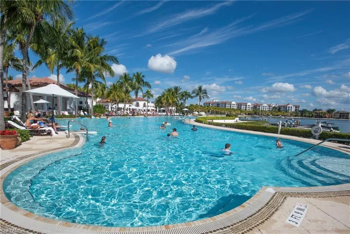 View of pool with the Blue Water Beach Grill in backround